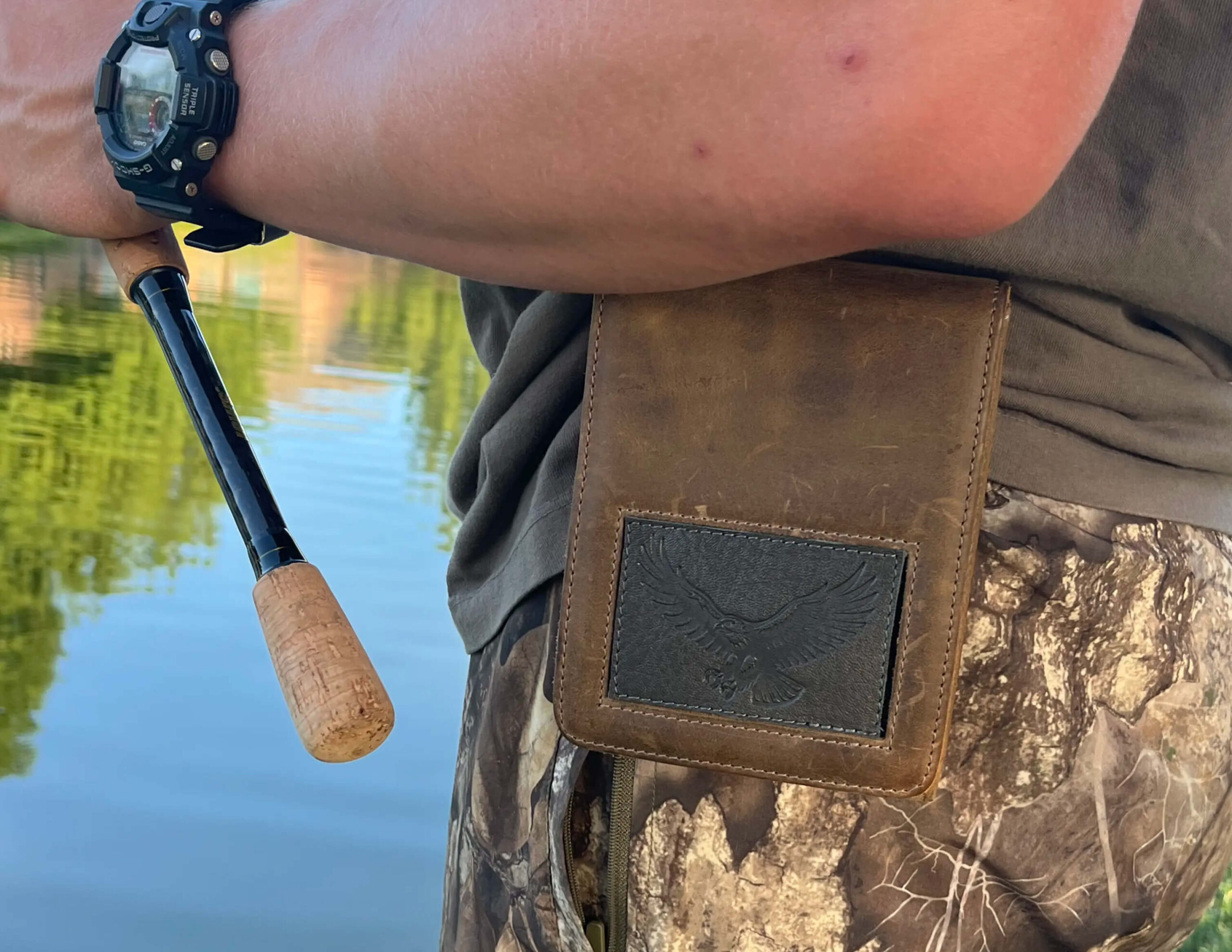 Close-up of a hand reaching for a Sneaky Pete holster